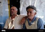 greece-greek-faces-dodecanese-arki-island-two-old-men-singing-together-A2GK59