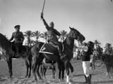 1937. Mussolini with a Sword of Islam raised in the name of Islam. Mussolini sought to win the hearts of Muslims and Arab nationalists in the Middle East