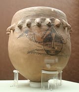 Pottery_pot_with_human_and_fish_design_from_Neolithic_age_(9000_to_2000_BC)._Found_in_Shaanxi_province._Beijing_Capital_Museum