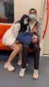 woman_helps_man_have_fun_on_public_transportation_thumb.jpg