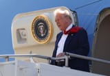 President-Donald-Trump-walks-off-Air-Force-One-to-speak-to-Air-National-Guard-Troops-on-April-29-202