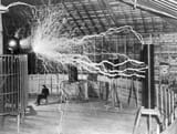 Nikola_Tesla_with_his_equipment_EDIT-1024x773