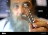 an-orthodox-jewish-diamond-dealer-shows-off-the-quality-of-one-of-BR5T62