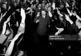 members of the NSDAP greeting Adolf Hitler on his arrival in the Hofbraeuhaus on the occasion of the celebration to the 21. anniversary