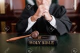 181849790-selective-focus-of-bible-and-gavel-near-cropped-judge-on-blurred-background[1]