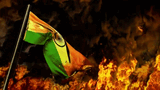 waving-india-flag-burning-fire-footage-238666676_iconl-4174666259