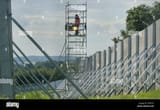 a-security-officer-on-a-watchtower-keeps-a-lookout-on-the-perimeter-G5XP7G
