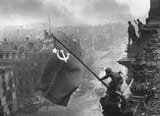 Raising_a_flag_over_the_Reichstag_-_Restoration