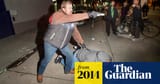 undercover cop pulling gun at protest