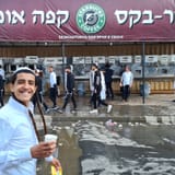 03-A-Hasidic-pilgrim-walks-towards-the-grave-of-Rabbi-Nachman-who-died-in-Uman-in-1810-1694942918