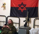 Ukraine_nationalist_with_rifle_&amp;_nationalist_flag