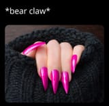 WomanShowingherPinkStilettoShapedNails