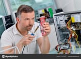 depositphotos_174312576-stock-photo-repairing-an-old-computer