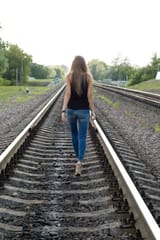 14131764-girl-traveling-by-railroad