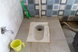 shit covered hole and %22bidet%22 bucket