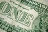 72767848-caption-one-and-in-god-we-trust-on-the-one-dollar-bill-cash-money-close-up-photo