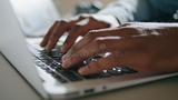 brown-hands-typing