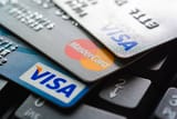 group-of-credit-cards-on-computer-keyboard[1]