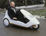 Sir-Clive-Sinclair-demonstrating-his-C5-electric-vehicle-the-battery-pedal-powered-trike-2680226590