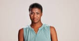 black-woman-portrait-and-expression-in-studio-for-gross-disapproval-and-reaction-to-smell