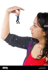 gigantic-woman-holding-a-tiny-little-businessman-as-a-metaphor-for-loss-of-self-confidence-the-man-is-feeling-vulnerable-and-defenseless-isolated-on-2ACJ6JJ