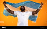 black-man-with-argentina-flag-shouting-and-celebrating-sports-team-victory-2ANC3F5