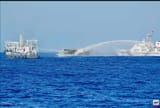 Philippine resupply boat, as it get bombarded and beset by China Coast Guard watercannons