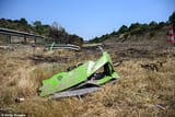 99970405-14872597-An_acid_green_piece_of_what_appears_to_be_the_front_of_the_Lambo-a-18_1751555342705