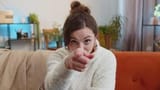 pretty-young-woman-smiling-pointing-to-camera-choosing-lucky-winner-indicating-inviting-approve-video