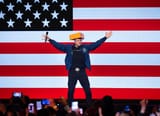 Billionaire-businessman-Elon-Musk-arrives-for-a-town-hall-meeting-wearing-a-cheesehead-hat-CN-1-4286316760