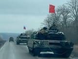 Russians flying Soviet flag