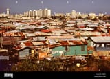 modern-buildings-tower-over-the-shanties-crowded-along-the-martin-pena-canal-february-1973-san-juan-puerto-rico-P889JY