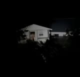 Summer camp cabin floating in the flash floods from Guadalupe River