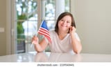 down-syndrome-woman-home-holding-260nw-1159543441