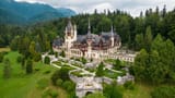 aerial-drone-view-peles-castle-romania-scaled