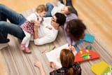 family-playing-on-rug