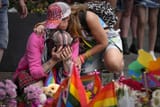 59513569-0-A_mourner_cries_as_they_lay_flowers_at_the_makeshift_memorial_fo-a-4_1656175559466