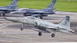 A-12th-TRG-RF-5E-returns-to-Hualien-while-F-16s-await-at-the-end-of-runway[1]