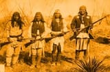 Natives with rifles, palesskin chasers