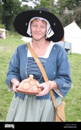 a-17th-century-english-woman-at-the-re-enactment-of-the-battle-of-B3AKC6