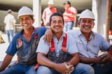 three-happy-latin-american-construction-workers-taking-break_311755-401