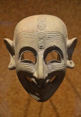 Phoenician_grinning_mask_-_Cagliari,_Museo_Archeologico_Nazionale_(26721011486)