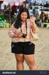 stock-photo-fat-thai-girl-with-a-camera-on-her-neck-pattaya-thailand-1535010068