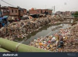 stock-photo-new-delhi-india-sep-new-delhi-indira-gandhi-camp-slum-area-situated-near-drain-which-full-1988515292