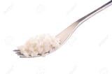23837445-fork-with-rice-close-up-isolated-on-white-background