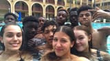 italian girls and refugees basketball team - Group of young people in a swimming pool