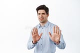no-thank-you-disgusted-reluctant-man-shaking-hands-to-refuse-rejecting-bad-offer-frowning-cringe-standing-bothered-214341819