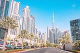 scenic-view-street-road-with-skyscrapers-buildings-famous-burj-khalifa-background_984126-255