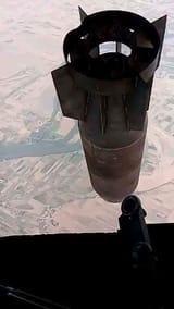 dropping barrel bomb eir ezzor