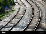 empty-main-line-railway-tracks-with-curve-PGGWW3
